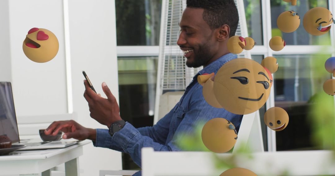 Man Engaged with Social Media Network and Emojis Display