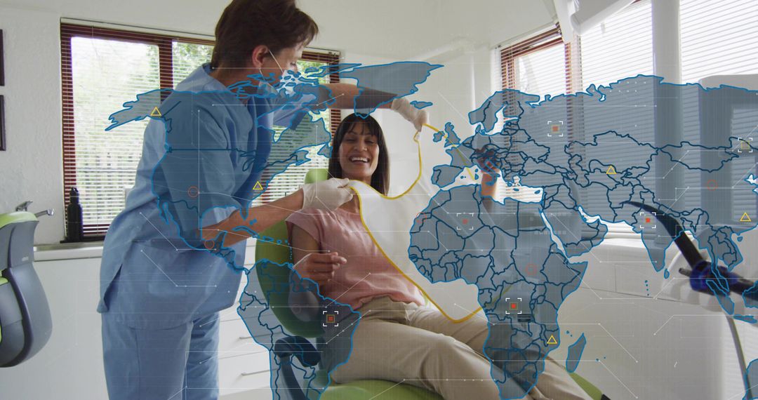 Dentist holding suction while patient smiling with global digital map overlay