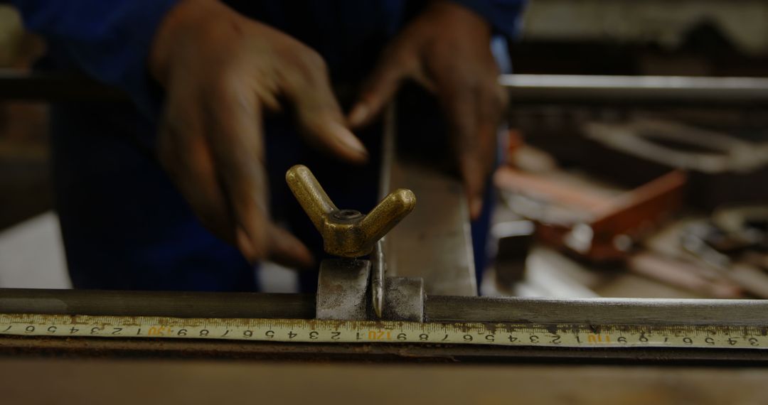 Close-up of Worker Adjusting Precision Ruler in Workshop - Free Images, Stock Photos and Pictures on Pikwizard.com