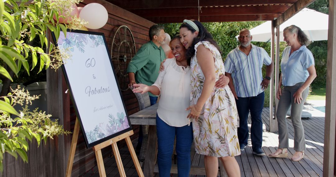 Diverse Senior Friends Celebrating 60th Birthday Outdoors