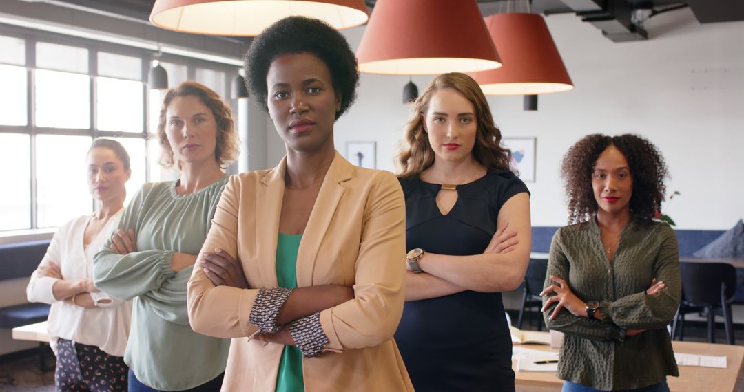 Confident Multiracial Businesswomen Standing with Folded Arms in Modern Office - Free Images, Stock Photos and Pictures on Pikwizard.com