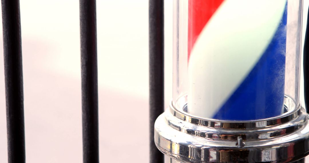 Close-Up View of Classic Barbershop Pole with Spiral Design