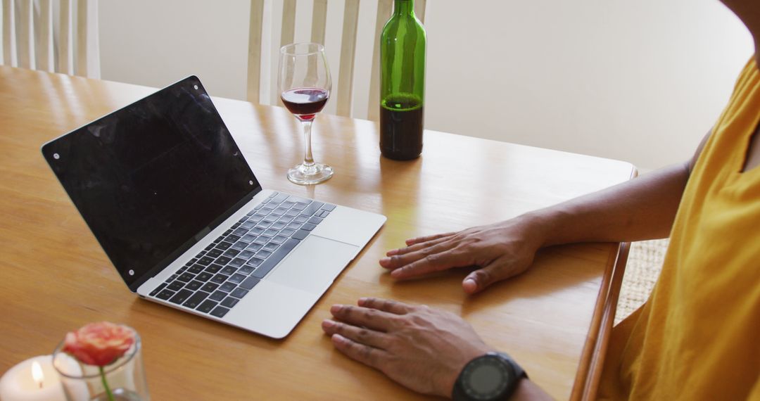 Person Having Wine While Using Laptop at Home - Free Images, Stock Photos and Pictures on Pikwizard.com