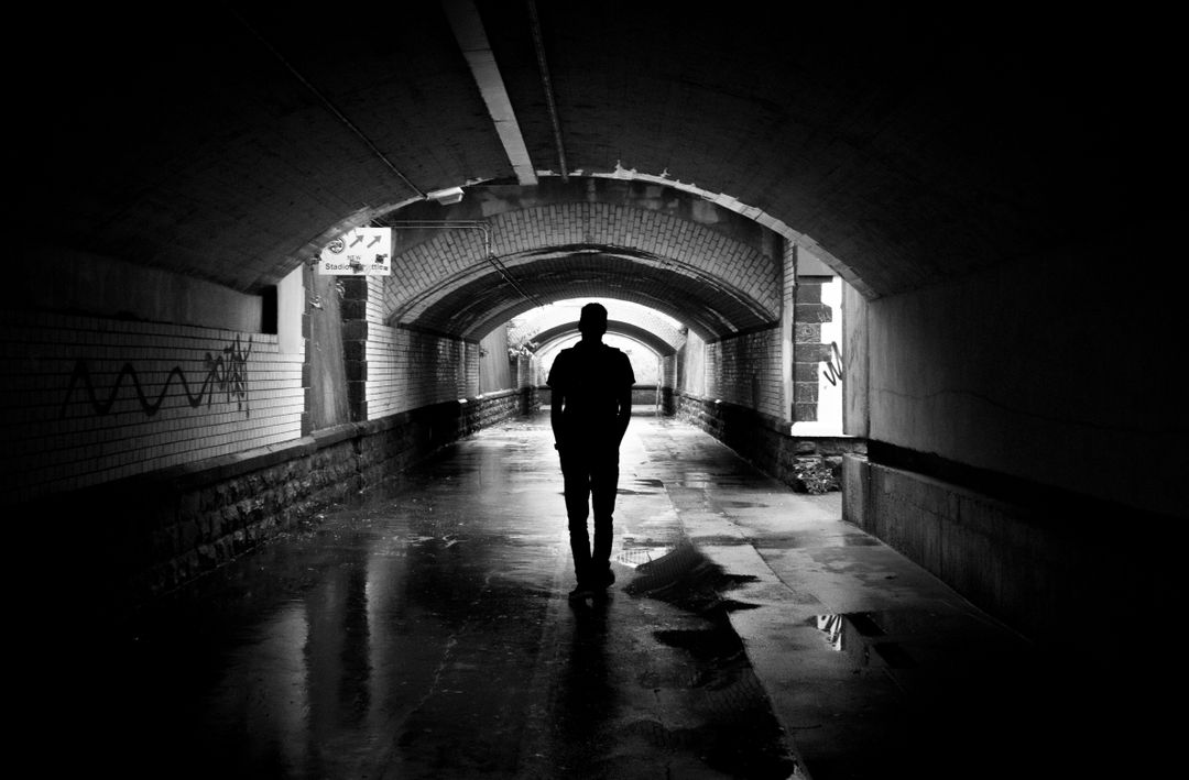 Silhouette Photo of a Man in a Tunnel - Free Images, Stock Photos and Pictures on Pikwizard.com