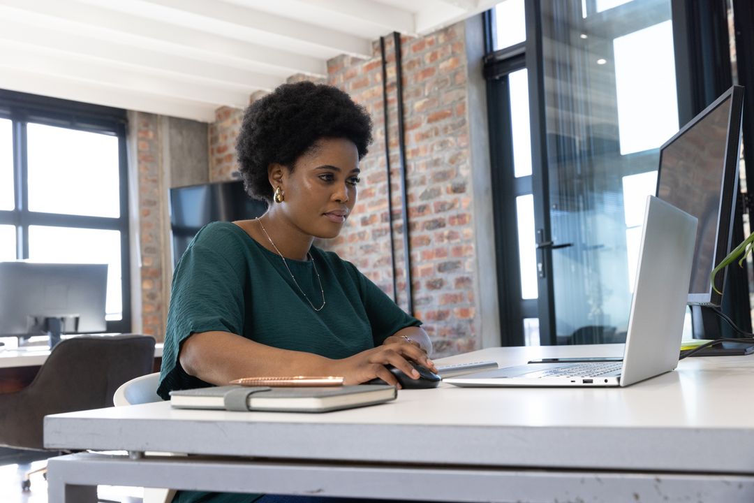 Confident African American Businesswoman at Modern Office Desk