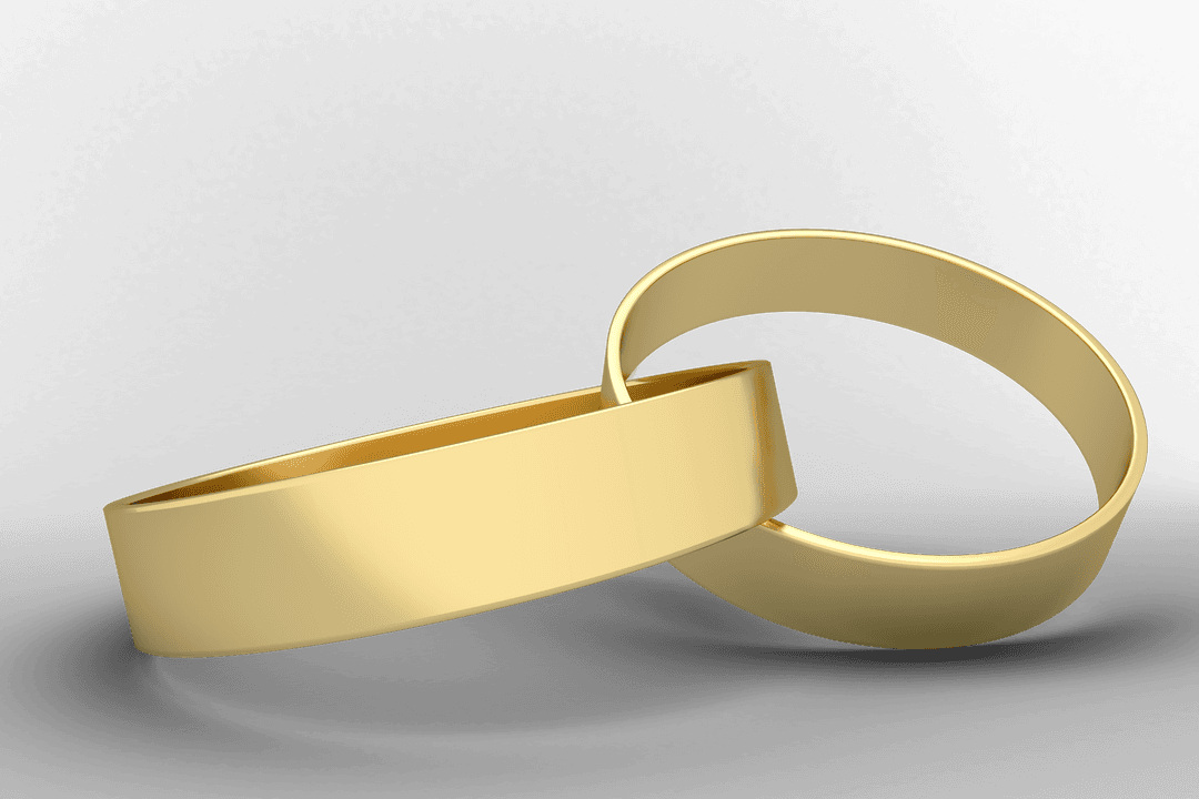 Close-up View of Transparent Gold Wedding Rings Pair