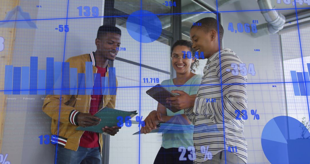 Diverse Business Team Analyzing Financial Analytics in Modern Office