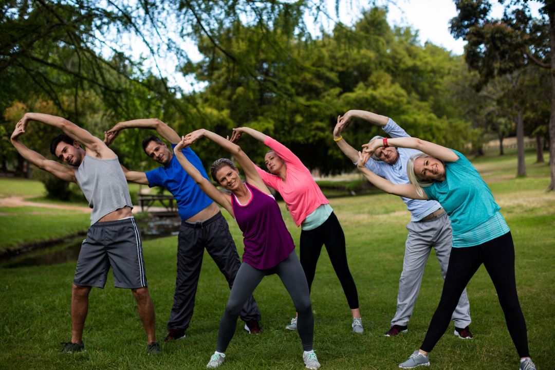 Group of people performing stretching exercise - Free Images, Stock Photos and Pictures on Pikwizard.com