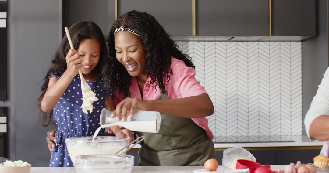 Diverse Multigenerational Family Enjoys Baking Together in Cozy Kitchen