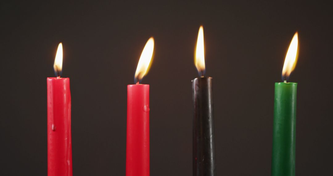 Close-Up of Burning Kwanzaa Candles on Dark Background - Free Images, Stock Photos and Pictures on Pikwizard.com