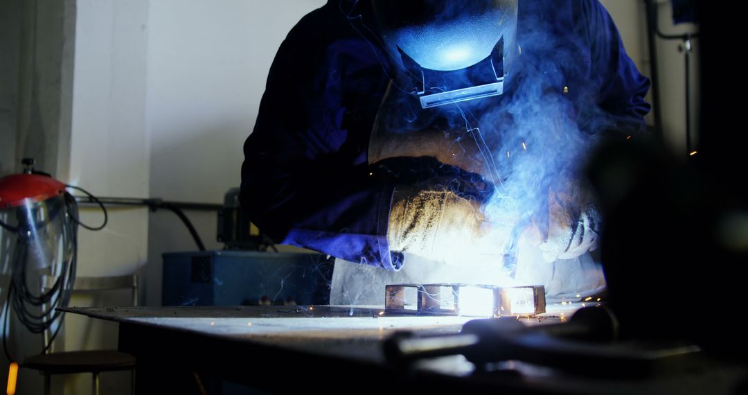 Industrial Welder Working with Welding Torch in Workshop - Free Images, Stock Photos and Pictures on Pikwizard.com