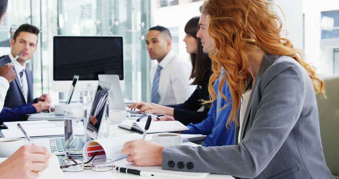 Team in Business Meeting Collaborating on Strategy