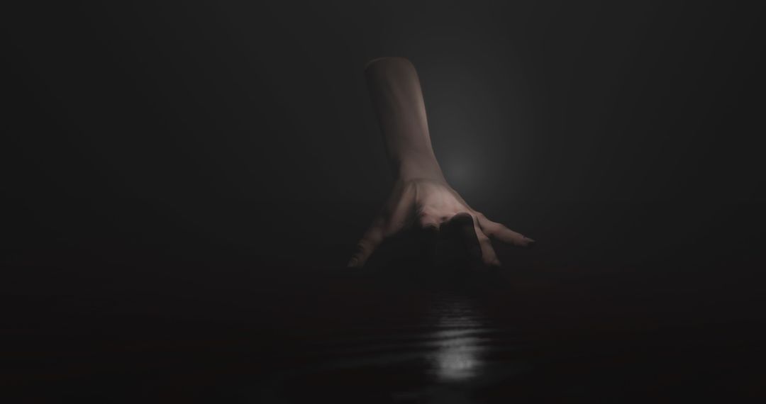 Eerie Hand Crawling in Dark Misty Environment