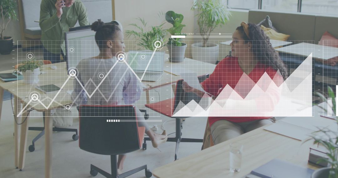 Team Collaborating Over Analytics Dashboard and Charts in Bright Open Office