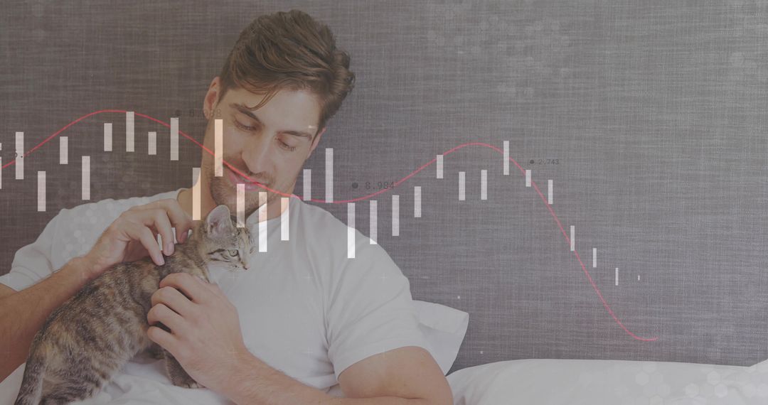 Man Relaxing with Kitten and Financial Graph Overlay in Bedroom