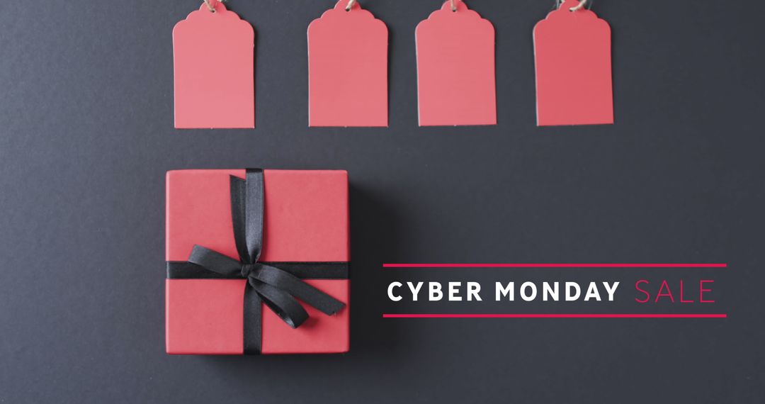 Cyber Monday Sale Concept with Gift Boxes and Tags on Dark Surface