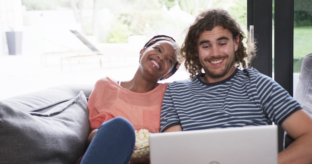 Couple Enjoying Movie Together at Home Relaxing with Laptop