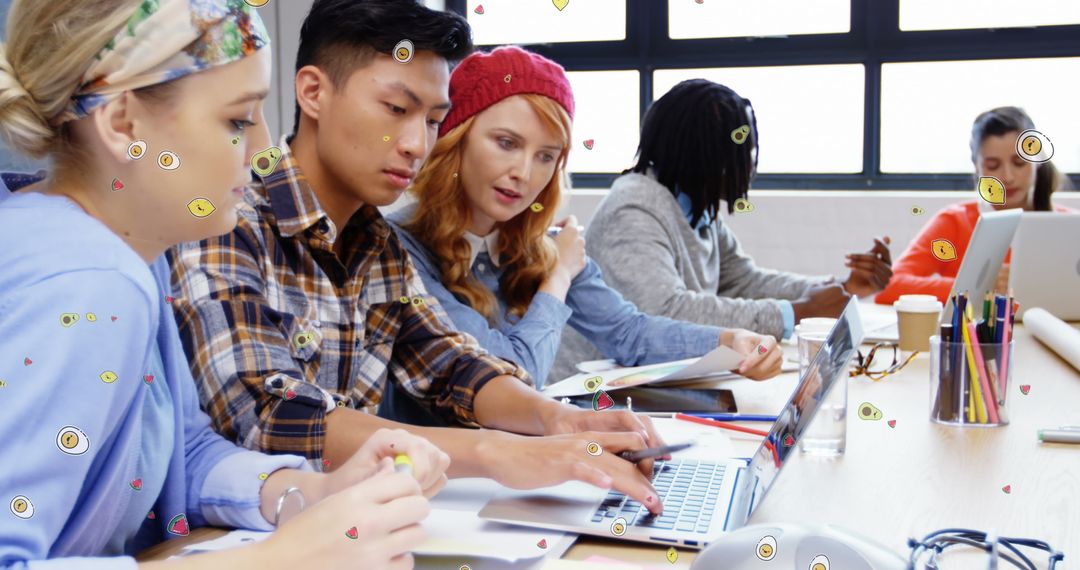 Diverse Students Collaborating with Laptops in Modern Classroom