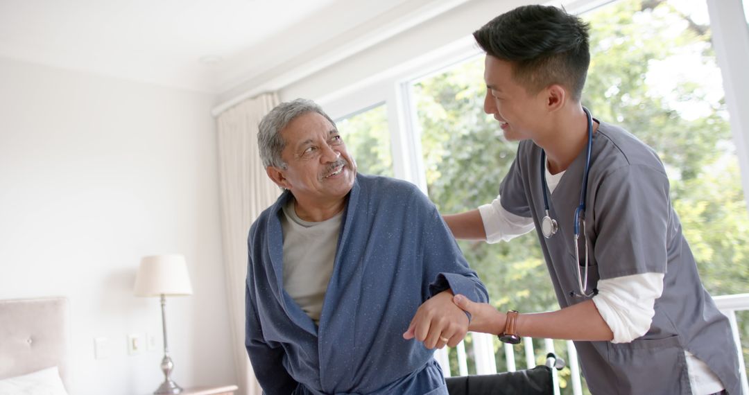 Healthcare Worker Assisting Elderly Man in Home Environment - Free Images, Stock Photos and Pictures on Pikwizard.com