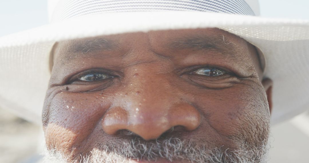 Close-up of Elderly Man with White Beard Wearing Hat - Free Images, Stock Photos and Pictures on Pikwizard.com