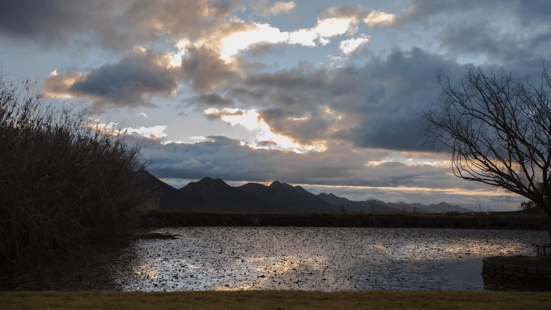 Transparent Clouds over Dusky Mountain Landscape at Sunset