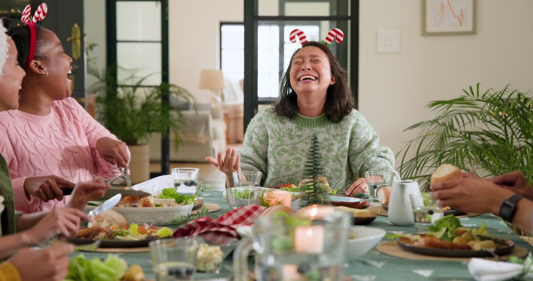 Mixed Heritage Friends Sharing Festive Dinner with Laughter and Joy