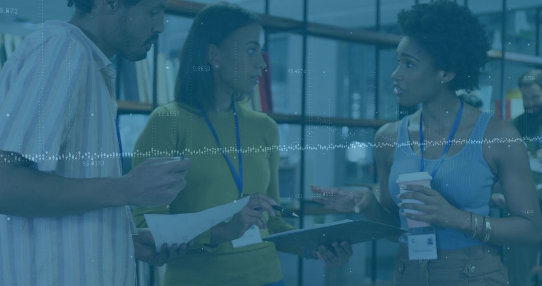 Diverse Colleagues Collaborating with Documents and Technology