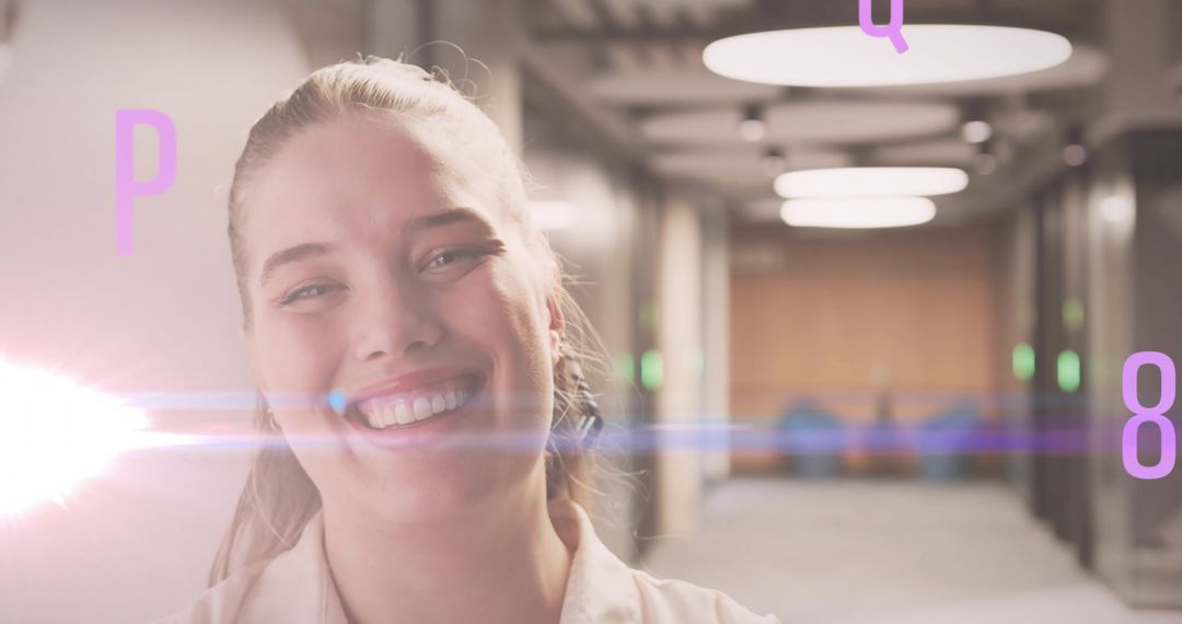 Smiling Woman in Futuristic Office Corridor with Floating Letters