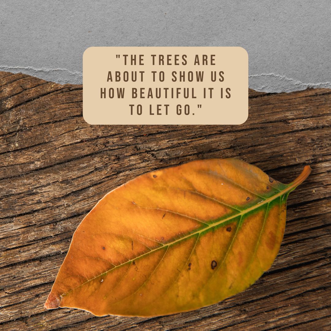 Inspirational Quote with Autumn Leaf on Wooden Surface