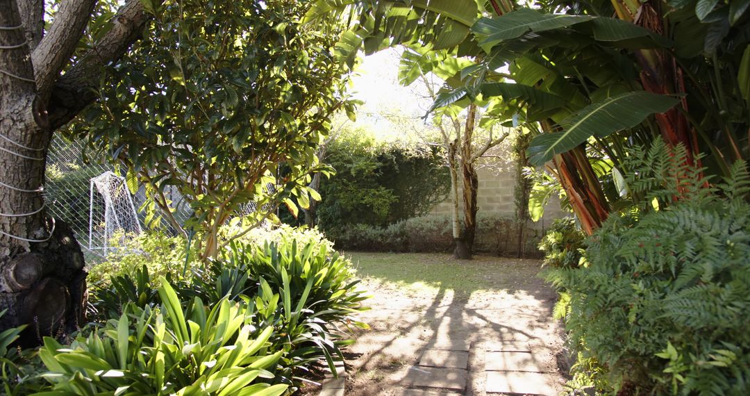 Serene Garden with Stone Pathway Leading to Soccer Goal
