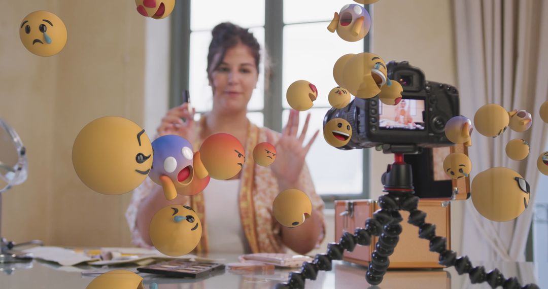 Vlogger Recording Tutorial Surrounded by Colorful Emojis