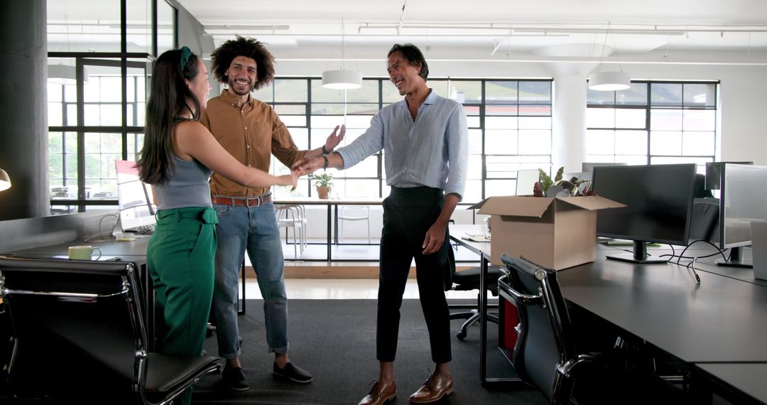 Diverse Colleagues Unpacking and Collaborating in Modern Workspace