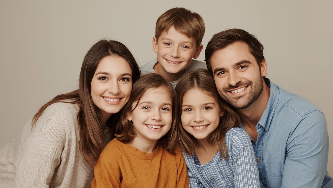 Smiling Family with Two Children Posing Together