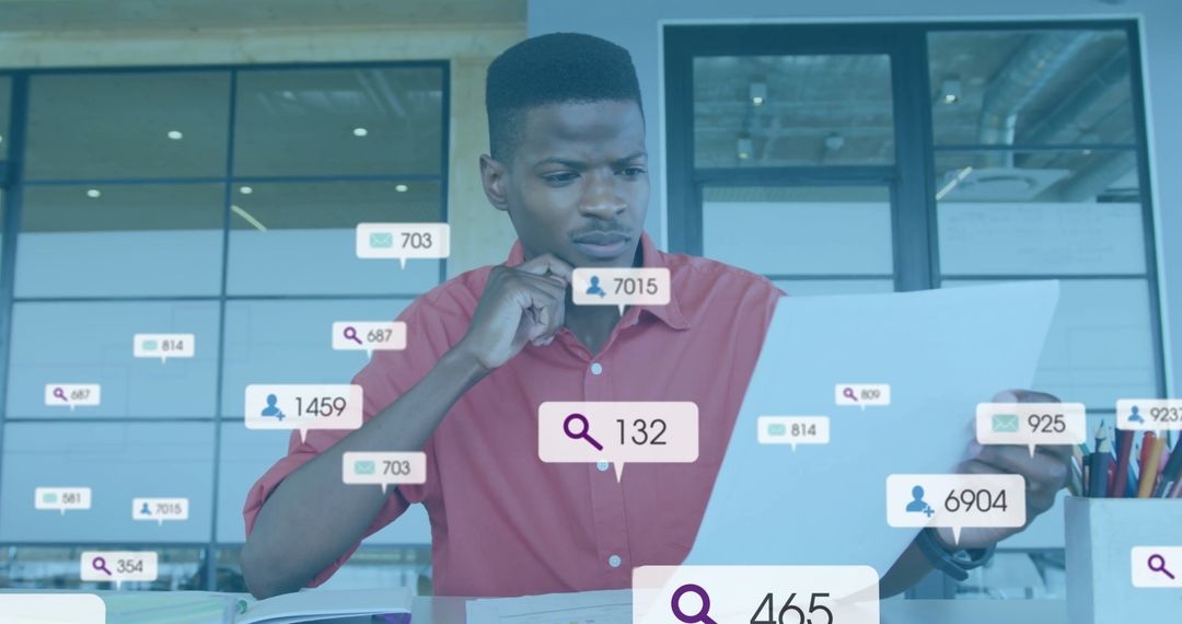 Data Analyst in Modern Office Analyzing Information on Laptop