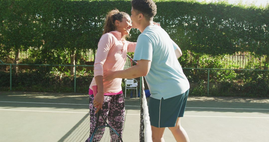 Sportsmanship Celebrated As Players Embrace After Friendly Tennis Match - Free Images, Stock Photos and Pictures on Pikwizard.com