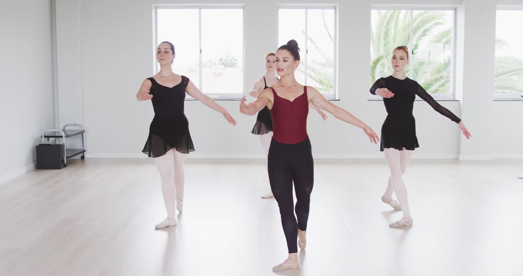 Group of Ballet Dancers Practicing in Dance Studio with Mirrors and Windows - Free Images, Stock Photos and Pictures on Pikwizard.com