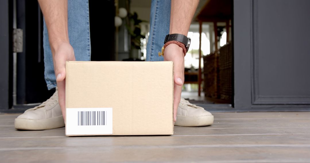 Man Collecting Package at Home Doorstep