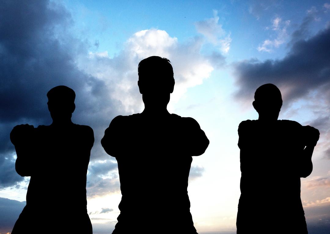 Silhouette of three determined people standing against cloudy sky - Free Images, Stock Photos and Pictures on Pikwizard.com