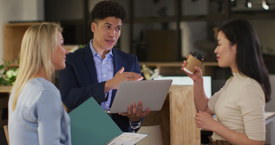 Diverse Business Team Discussing Project in Office Environment