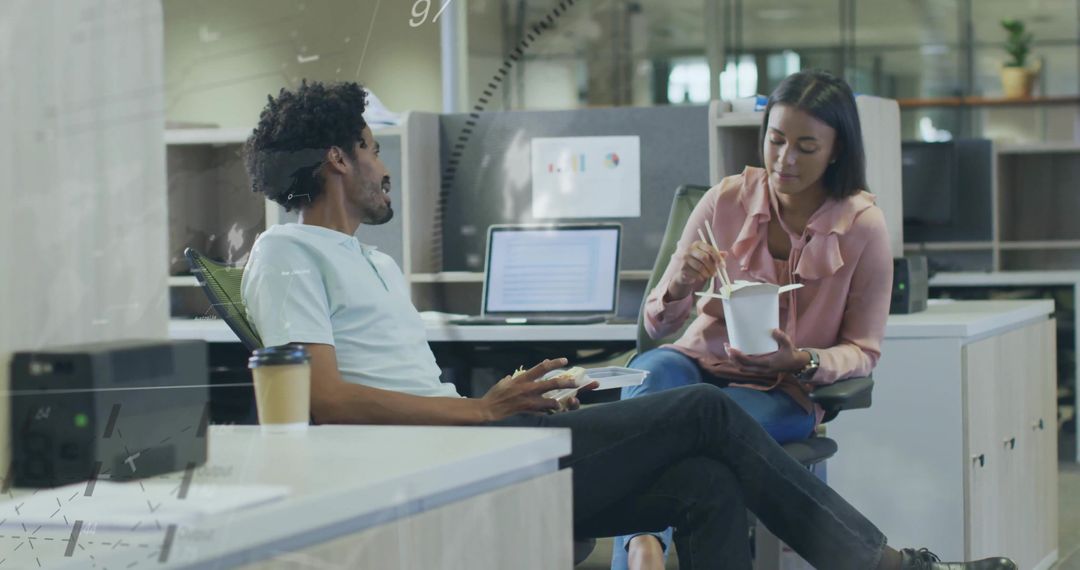 Professional Colleagues Sharing Lunch in Modern Office Setting