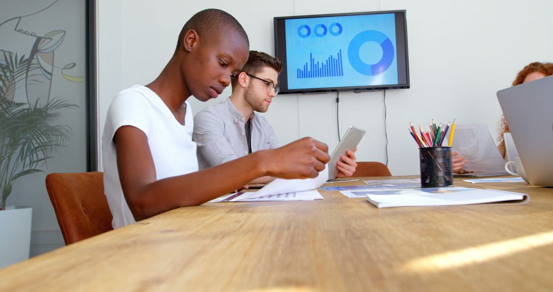 Diverse Team Analyzing Data During Business Meeting - Free Images, Stock Photos and Pictures on Pikwizard.com