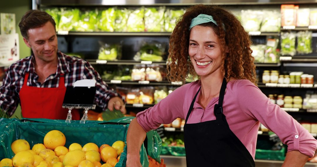 Grocery Store Employees Smiling While Stocking Fresh Produce - Free Images, Stock Photos and Pictures on Pikwizard.com