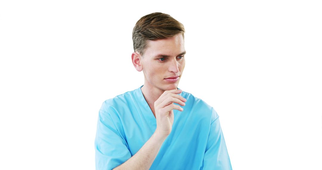 Young Male Nurse in Blue Scrubs with Thoughtful Expression Isolated on White - Free Images, Stock Photos and Pictures on Pikwizard.com