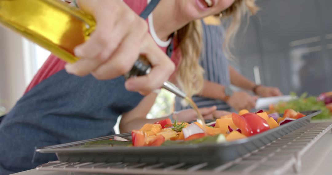 Person Drizzling Olive Oil on Freshly Chopped Vegetables - Free Images, Stock Photos and Pictures on Pikwizard.com