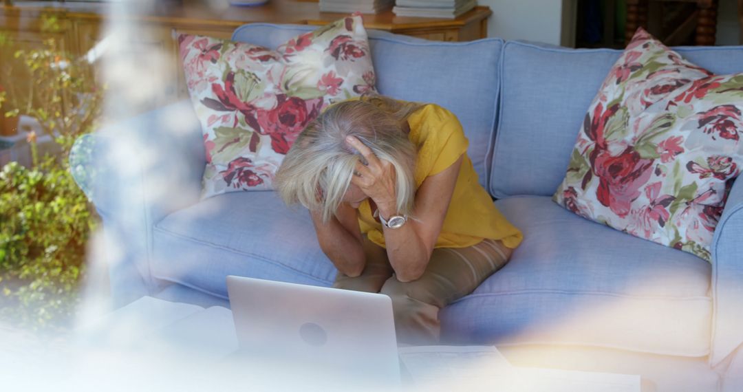 Stressed Senior Woman Facing Laptop in Living Room - Free Images, Stock Photos and Pictures on Pikwizard.com