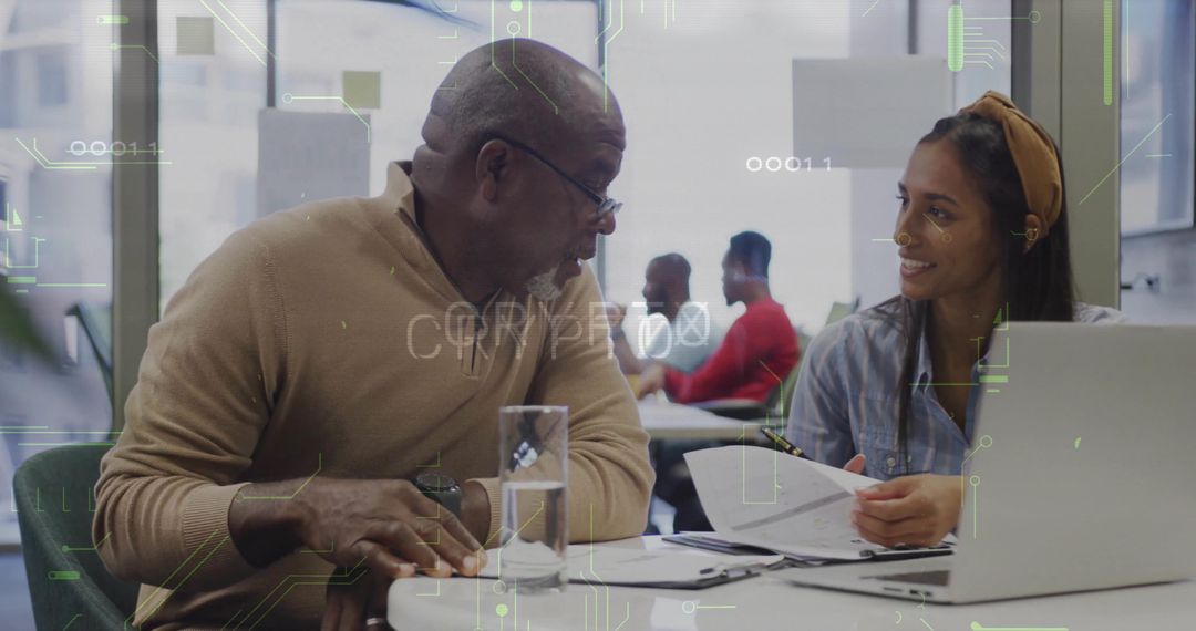 Mentor and Mentee Collaborating in Modern Office Setting