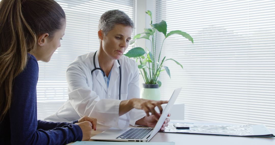 Female Doctor Consulting Patient and Discussing Results - Free Images, Stock Photos and Pictures on Pikwizard.com