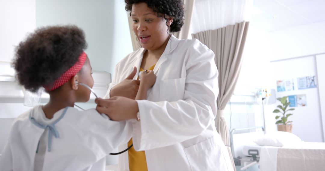 Female Doctor Examining Young Girl with Stethoscope in Hospital Room - Free Images, Stock Photos and Pictures on Pikwizard.com