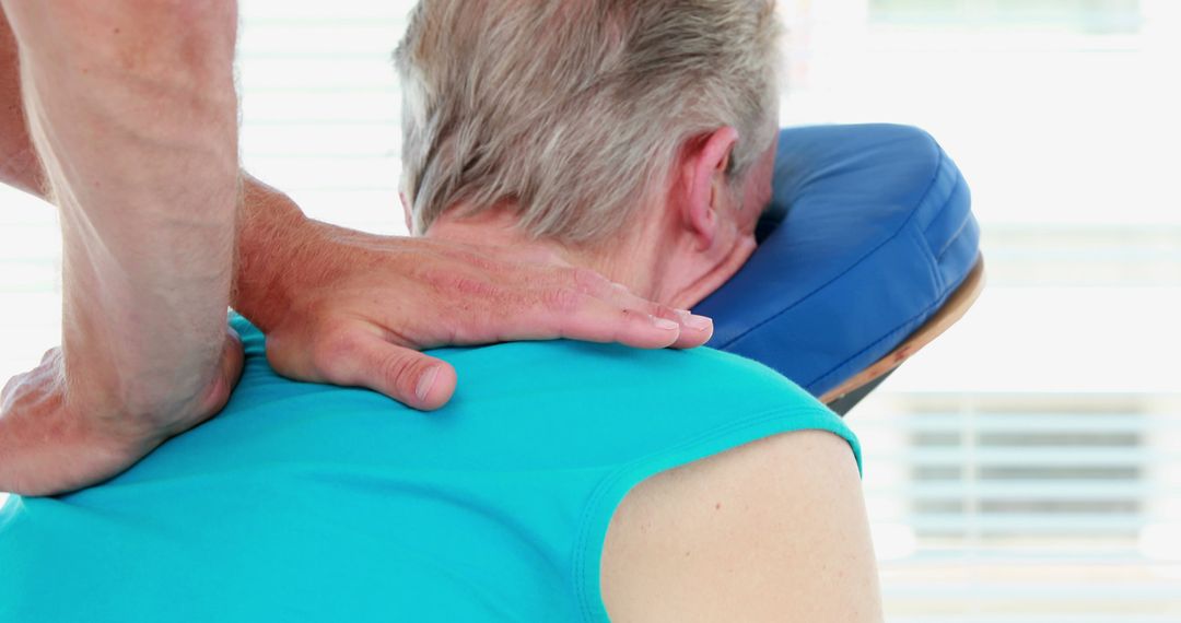 Middle-Aged Man Receiving Therapeutic Neck Massage - Free Images, Stock Photos and Pictures on Pikwizard.com