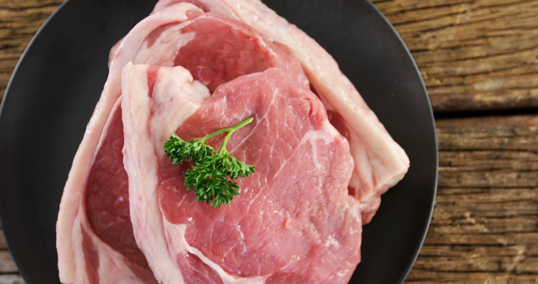 Fresh Raw Pork Chops on Rustic Wooden Background - Free Images, Stock Photos and Pictures on Pikwizard.com